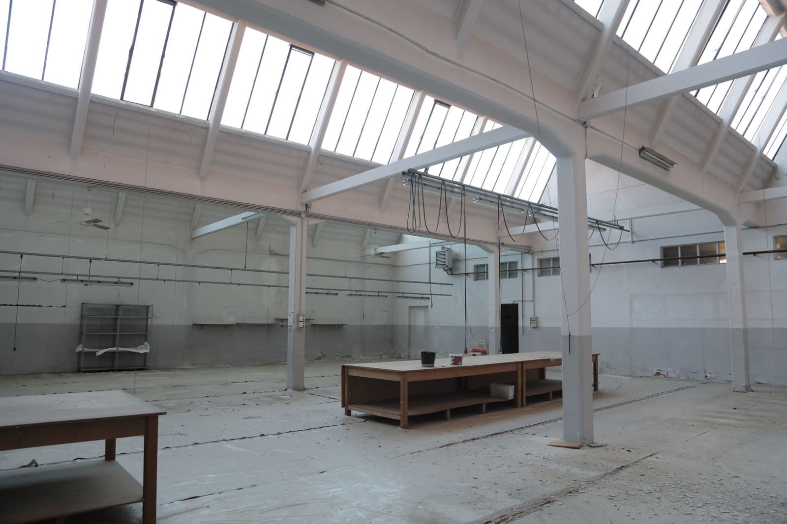 Plain bare concrete floor in a bright hall — where every transformation starts